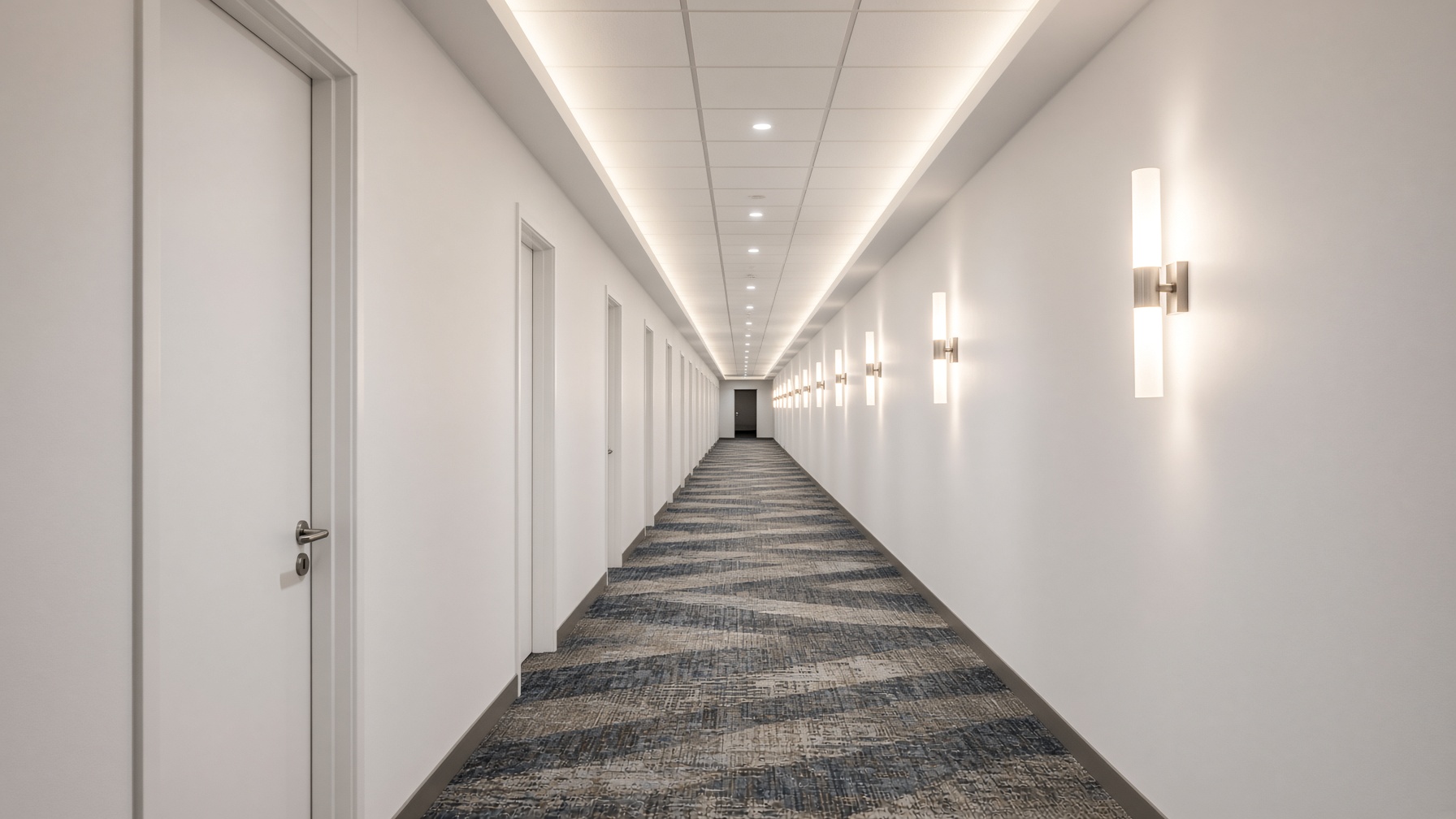 Finished hospitality corridor with smooth white drywall